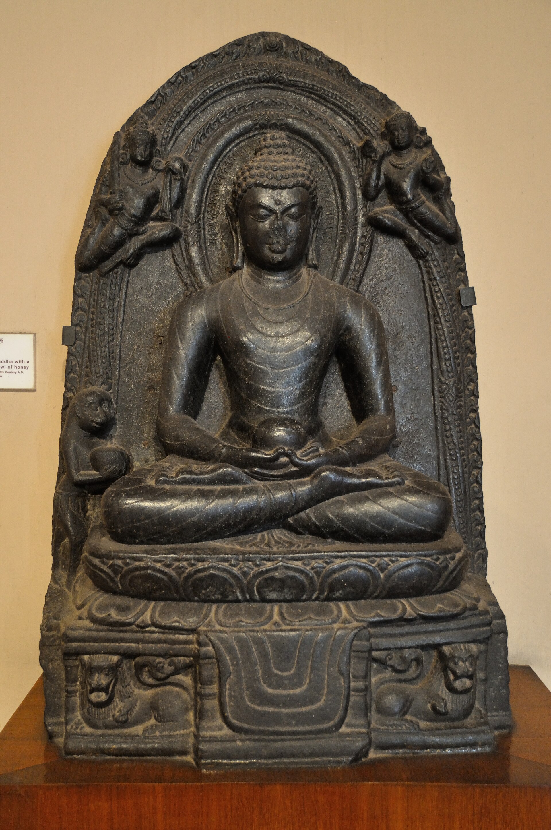 Buddha with a leonel of honey