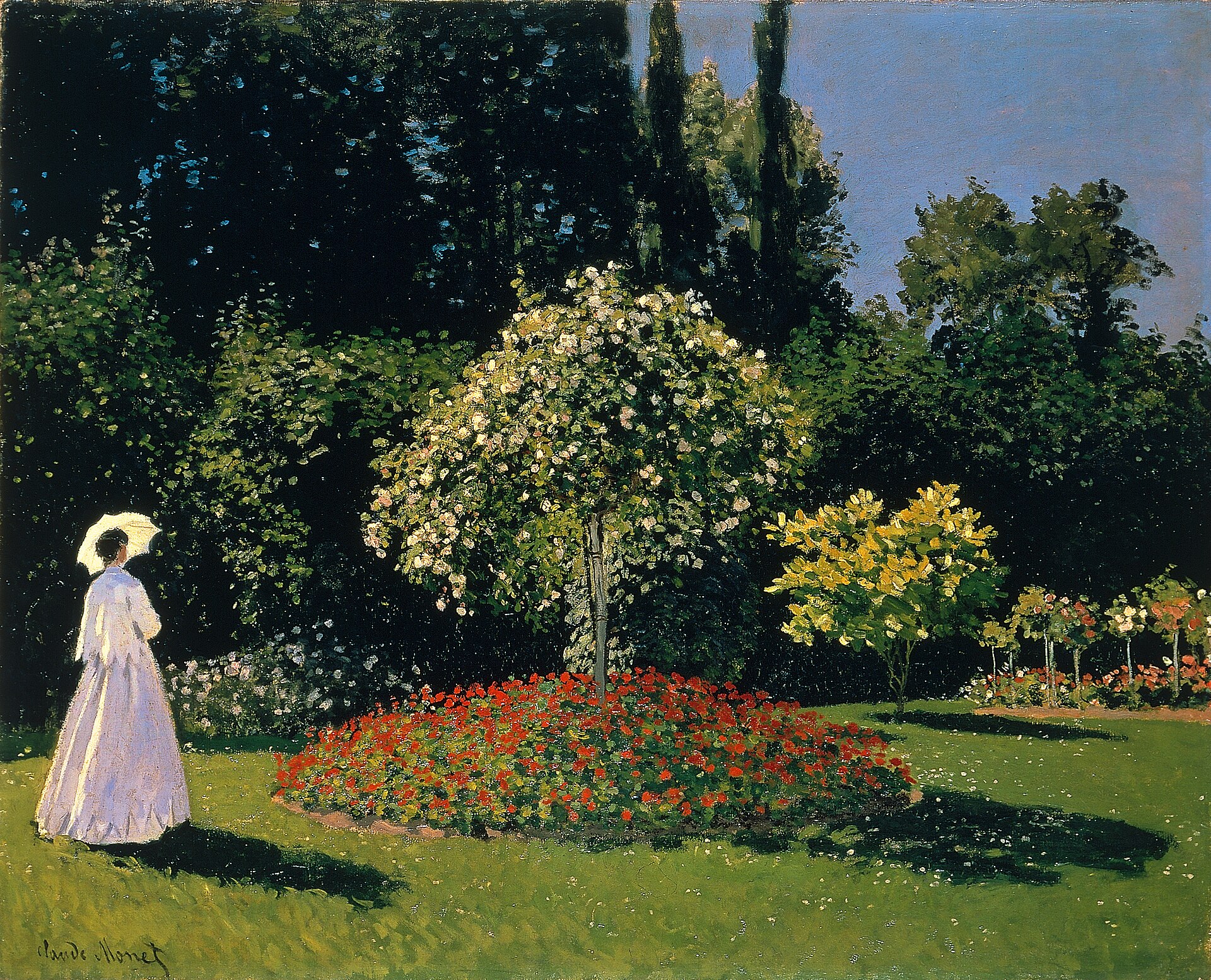 Femme en blanc au jardin